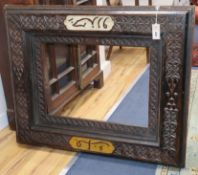 A Persian carved hardwood frame overall 81 x 99cm