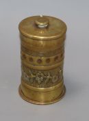 A tobacco jar (ex brass shell) height 15cm