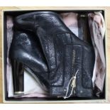 A pair of Stella Mccartney boots, size 6