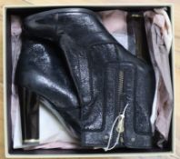 A pair of Stella Mccartney boots, size 6