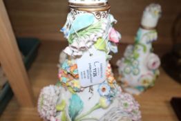 Three English porcelain flower encrusted scent bottles and covers, c. 1830-40, possibly