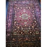 A Kashan blue ground rug 200 x 143cm