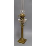 A brass Corinthian column oil lamp