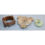 Three Chinese archaistic jade or hardstone zoomorphic carvings, including a bi disc, a ring and a