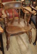 A Victorian elm and beech smoker's bow elbow chair