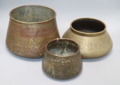 Three Persian engraved brass vessels