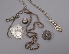 A silver pendant on chain and 3 other items.