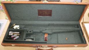 A tan leather shotgun case by Pietro Beretta