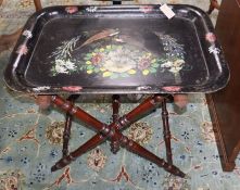 A Victorian toleware tray on turned folding stand W.77cm