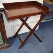 A Victorian mahogany butler's tray on folding stand W.77cm