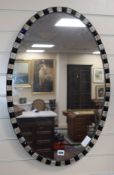 An Irish 18th century-style oval mirror W.50cm