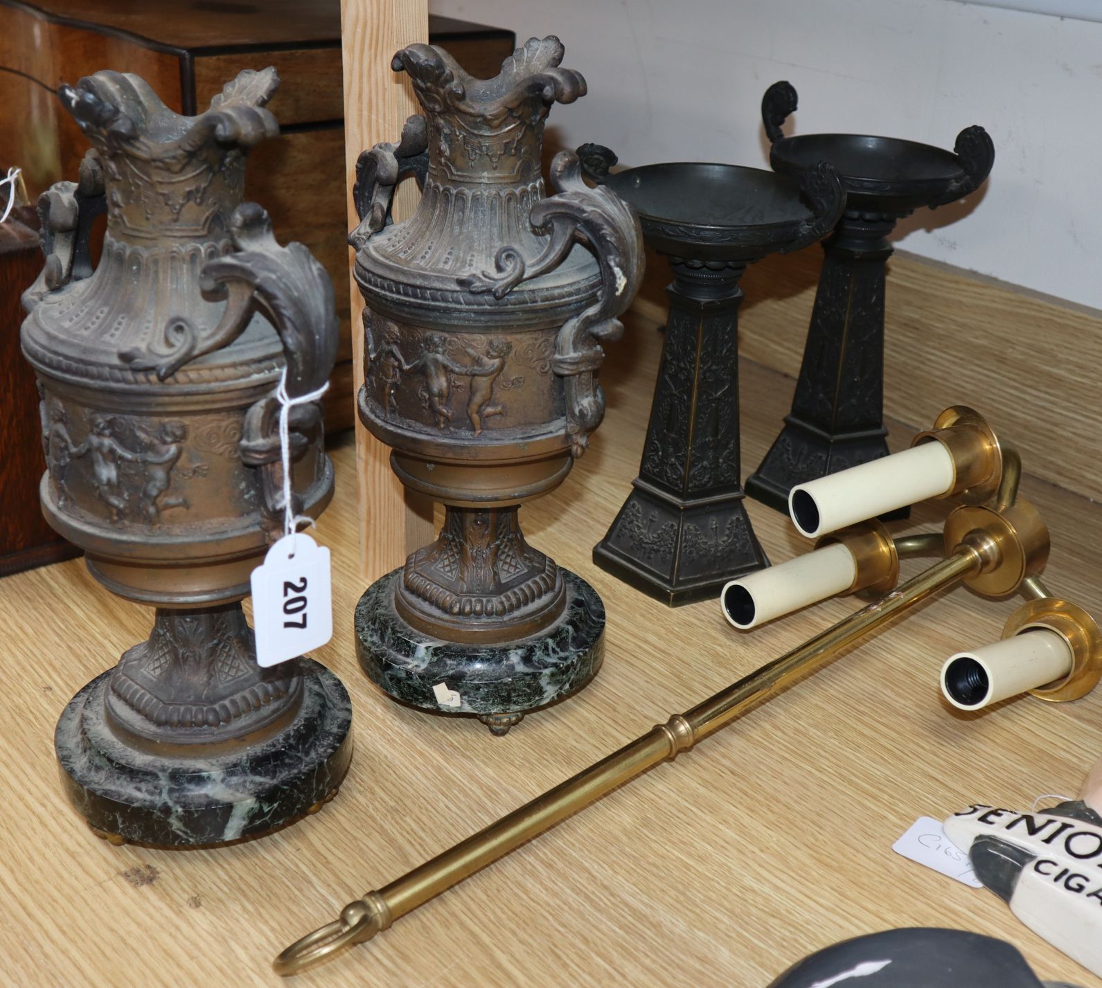 A pair of classical style spelter urns and three other items