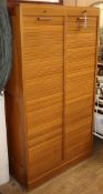 An oak double fronted tambour shutter filing cabinet W.83cm