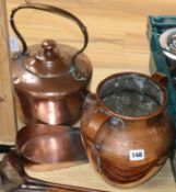 A copper kettle, a two handled pot and a scoop