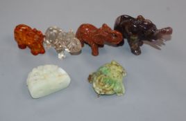 A Chinese jade carving, a jadeite pendant and four hardstone or amber elephants