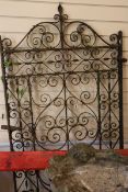 A weathered wrought iron garden gate 180 x 84cm