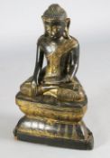 A large Thai gilt and black lacquered wood figure of Buddha Shakyamuni, 19th century, H. 64.5cm,