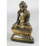 A large Thai gilt and black lacquered wood figure of Buddha Shakyamuni, 19th century, H. 64.5cm,