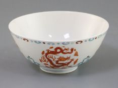 A Chinese doucai 'dragon' bowl, six character mark, D. 13cm