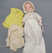 An Armand Marseille bisque-headed 'My Dream Baby' doll, no. 351/3 1/2K, with additional clothing