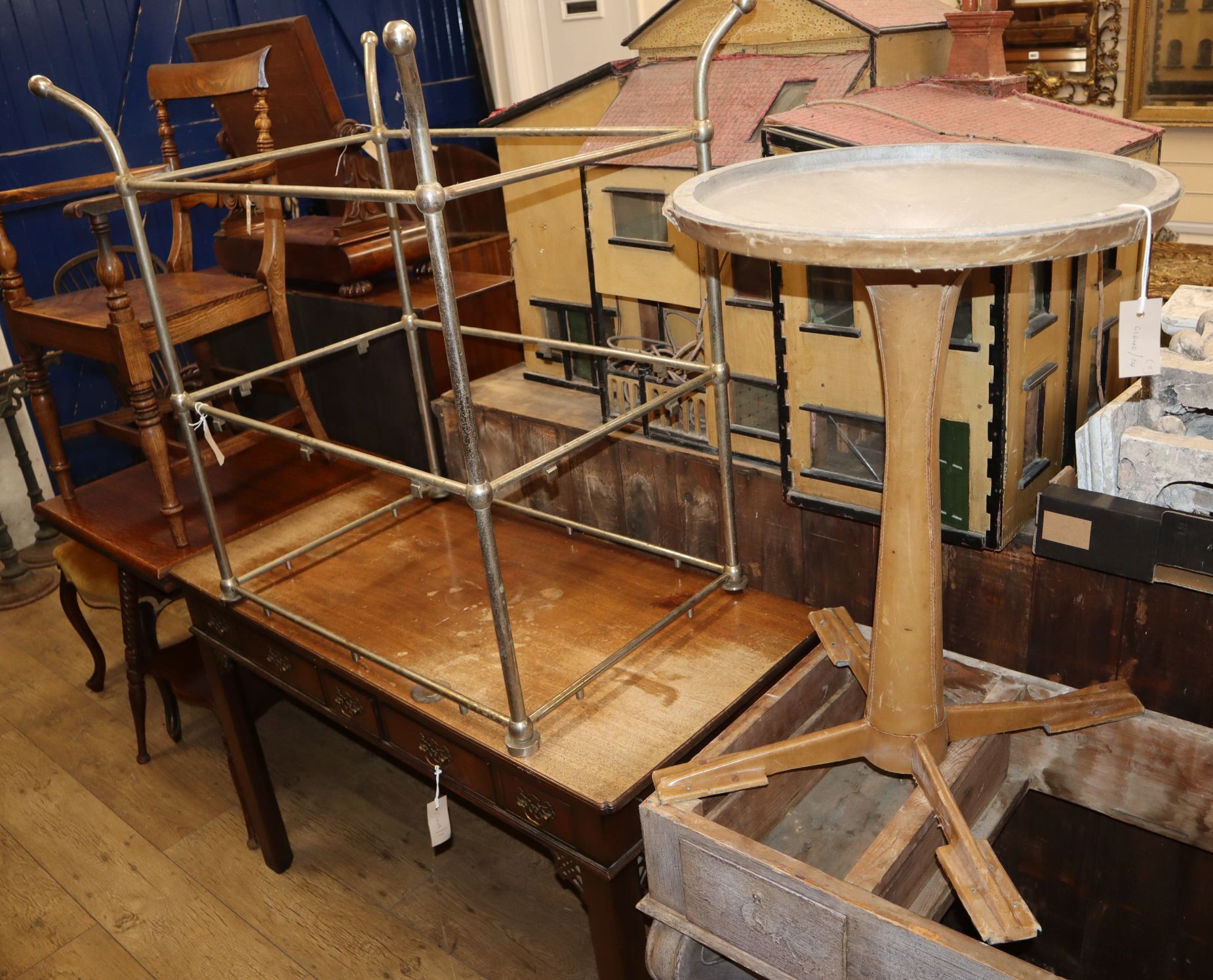 A steel two tier table frame and a leather covered table base