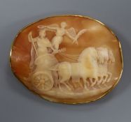 A 9ct mounted oval cameo brooch, carved with horses and chariot, 59mm.