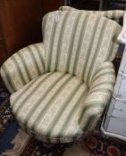 A pair of late Victorian green and cream striped upholstered low armchairs