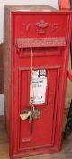 A Victorian cast iron postbox with key Height 72cm