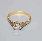 An 18ct gold and solitaire diamond ring, the round brilliant cut stone weighing approximately 0.