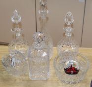 Four cut glass decanters, a Caithness paperweight, a bowl and a basket