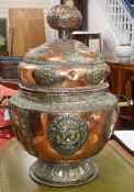 A large South East Asian copper and brass vessel with semi precious stone mounts height 75cm