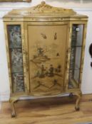 A 1920's chinoiserie lacquer bowfront display cabinet W.93cm