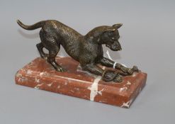 A bronze model of a dog, on marble base length 19cm