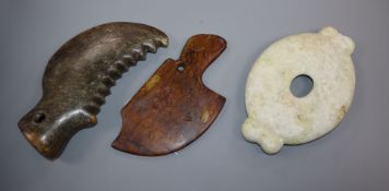 Two Chinese archaistic hardstone axe heads and an oval disc 19cm - 20cm