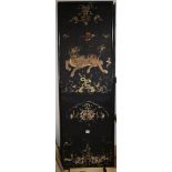 A pair of Chinese/Tibetan embroidered black satin 'qilin' panels, late 19th/early 20th century,