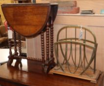 An oak and brass two division paper rack and a small Victorian Sutherland table