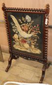 A Victorian mahogany needlepoint firescreen H.182cm