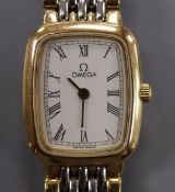 A lady's steel and yellow metal Omega De Ville quartz wrist watch.