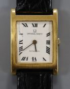 An 18ct yellow metal Universal manual wind rectangular dress wrist watch, with Roman dial, on