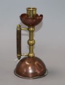 An Arts and Crafts copper and brass chamberstick height 18.5cm