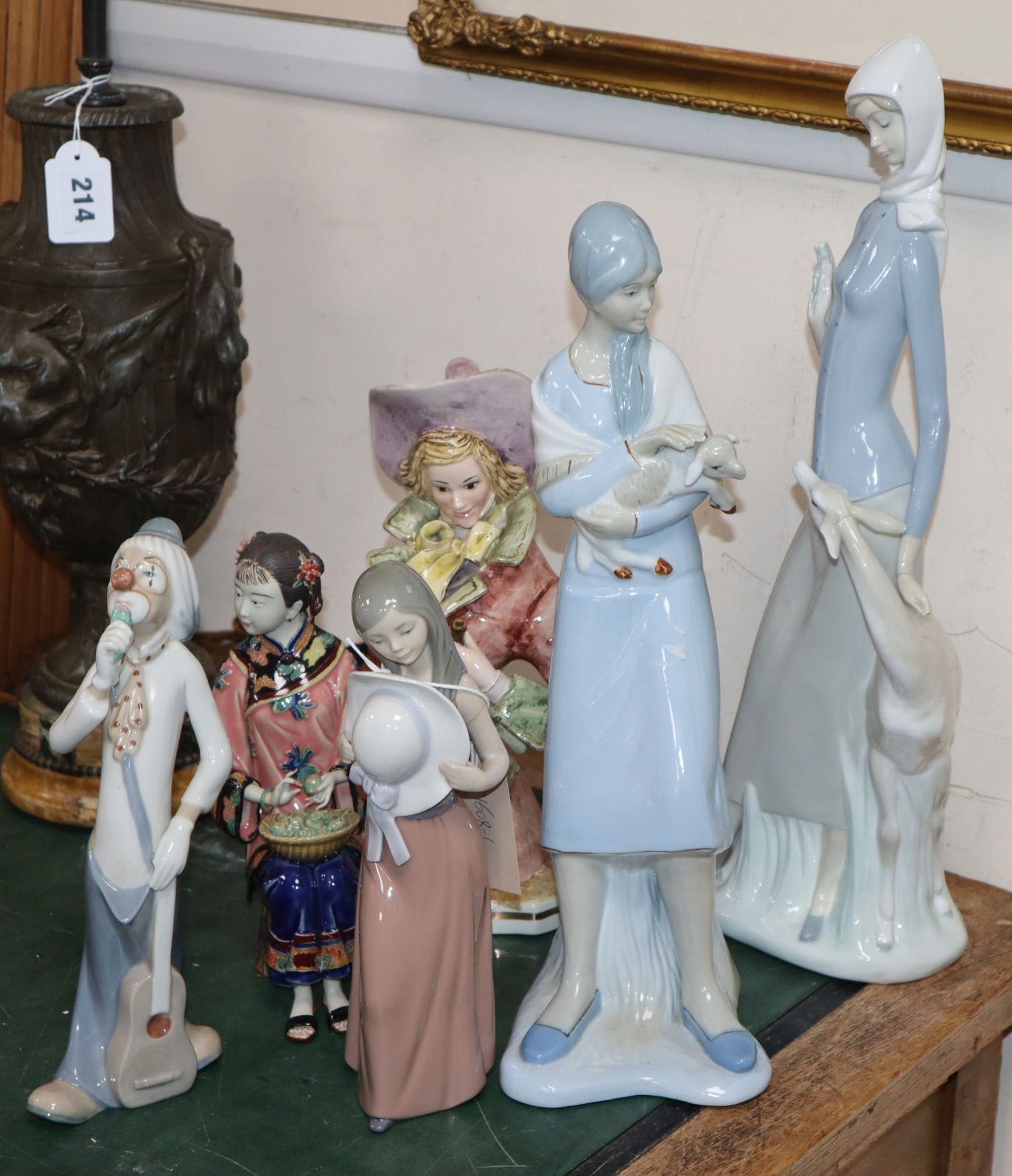Six porcelain figures including Lladro