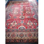 A Caucasian brick red ground carpet 387 x 277cm