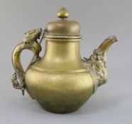 A 19th century Tibetan brass and silver overlaid teapot zoomorphic spout and dragon handle, H.