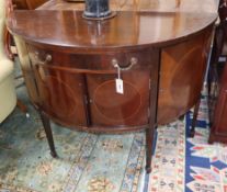 An Edwardian Sheraton Revival mahogany demi-lune sideboard W.122cm