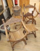 Four carved walnut X-framed elbow chairs