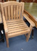 Four teak garden carver chairs