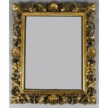 A 19th century Florentine carved and pierced giltwood wall mirror, W.2ft 3in. H.2ft 7in.