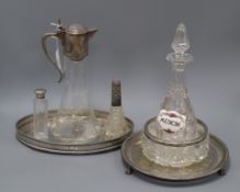 A cut glass bowl with a silver rim, a plated mounted glass claret jug, a glass decanter and sundry