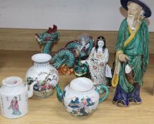 A group of Asian ceramics, comprising a a Kutani group of an immortal and lion dog, a similar teapot