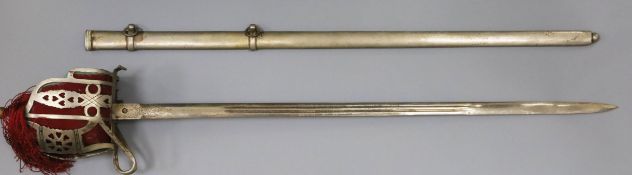 A Replica basket hilted sword, the blade decorated with a crown and foliate scrolls and stamped